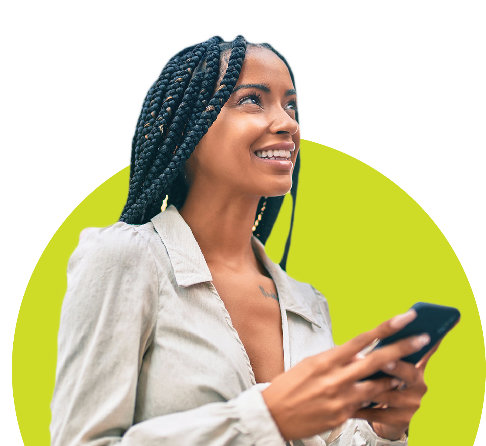 Black woman holding phone and looking up