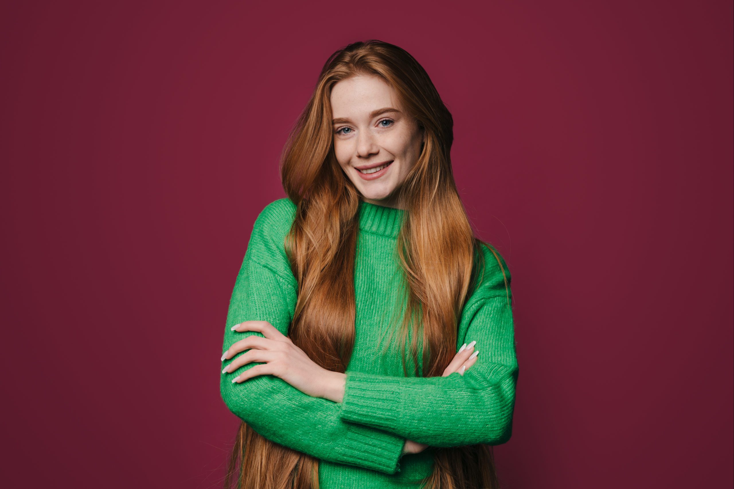 Cheerful Young Woman With Ginger Long Hair Smiling Happily