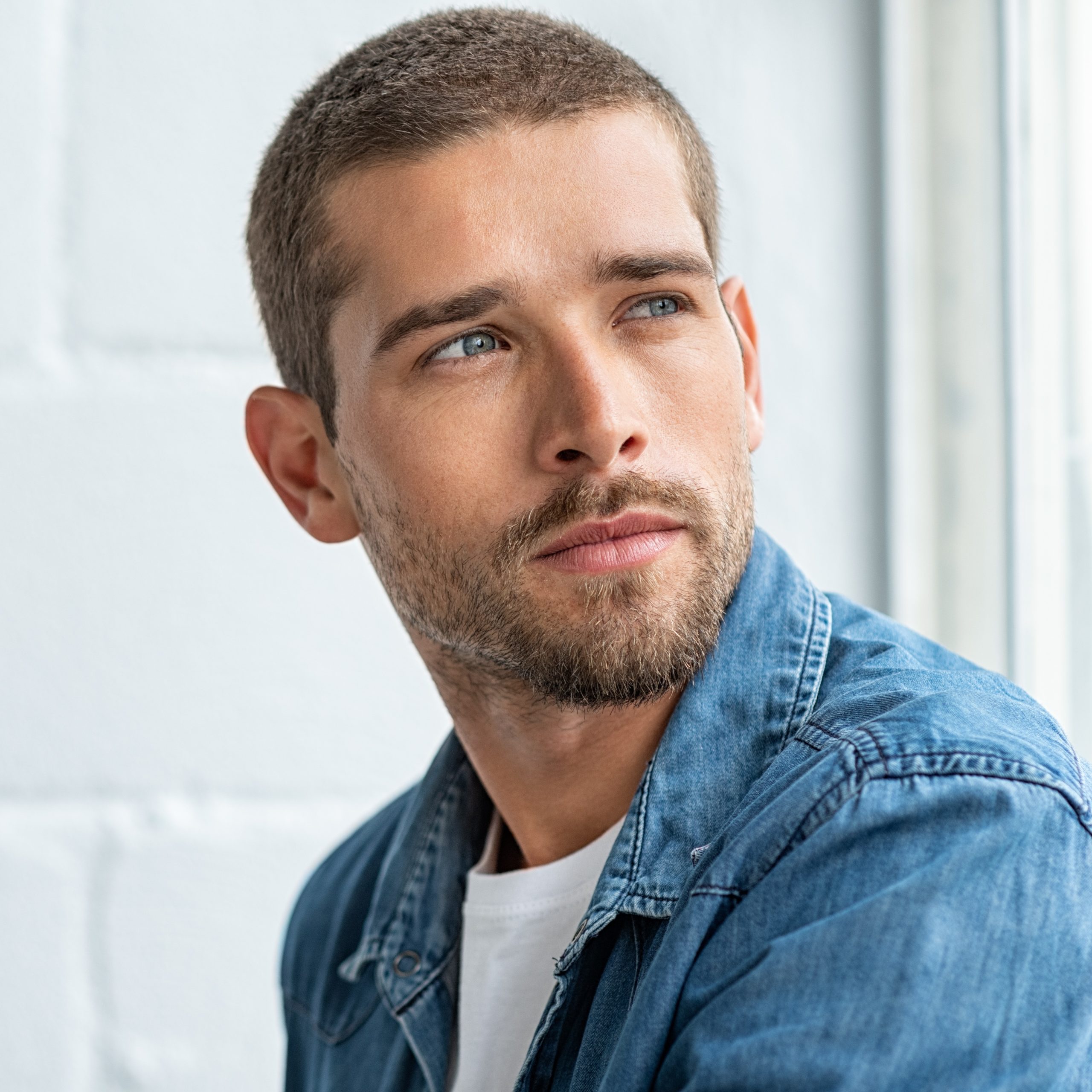 Young man looking away from camera